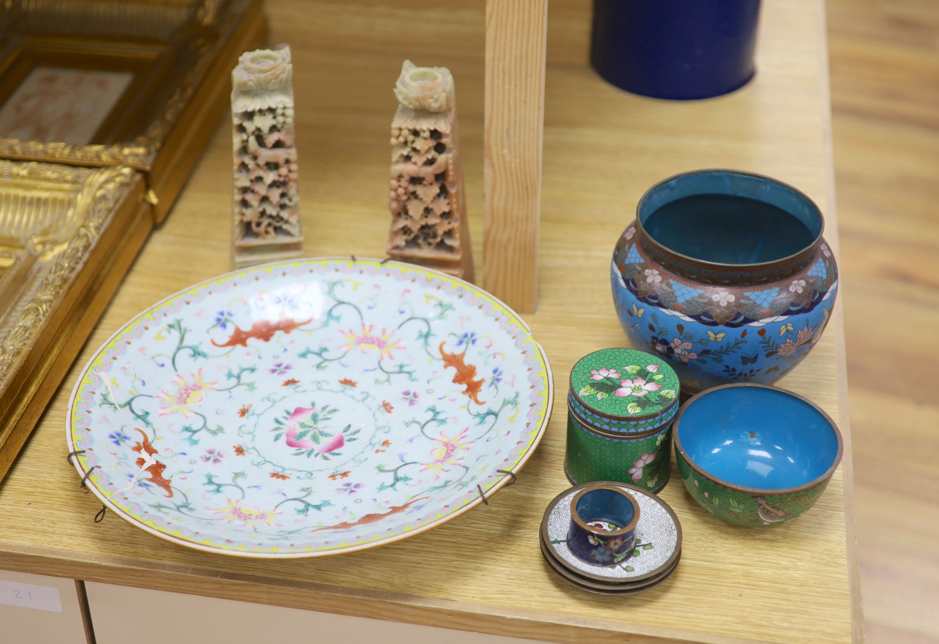 A group of Chinese and Japanese wares to include a famille rose dish, mixed cloisonne and a pair of soapstone carving, largest diameter